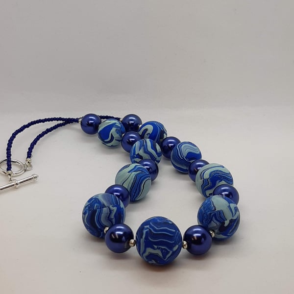 Blue swirl polymer clay necklace          