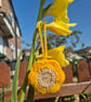 Flower shaped bag charm with small storage space.
