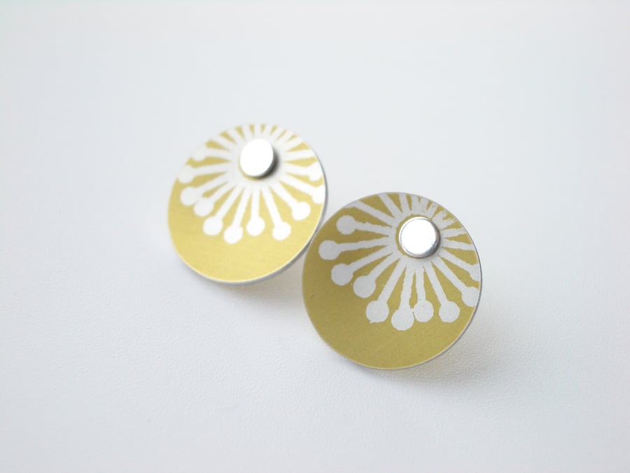 Yellow stud earrings with starburst print