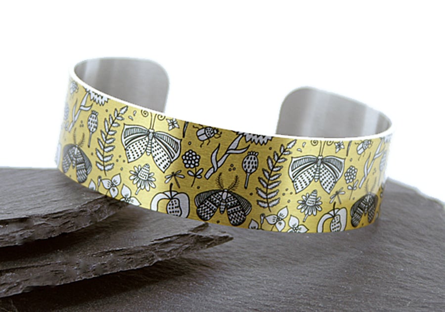 Butterfly jewellery cuff bracelet, yellow with brushed silver butterflies. B412