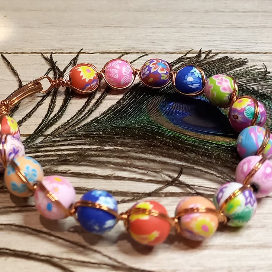 Twisted copper wire bracelet with polymer clay beads