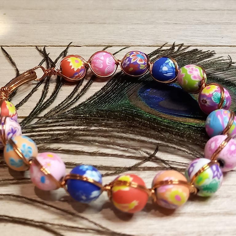 Twisted copper wire bracelet with polymer clay beads