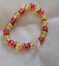 "Bright Minds" Yellow & Red Beaded Bracelet with Star Charm - Celebratin Neuro