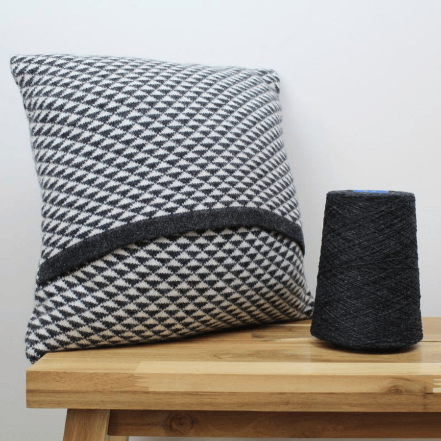 Triangle knitted cushion - monochrome