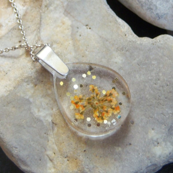 Resin pendant with dried flowers and sterling silver