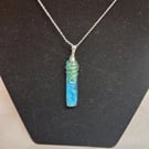 Blue resin wire wrapped silver pendant
