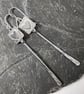 Silver long dangly pendulum earrings with hearts. - Image 2