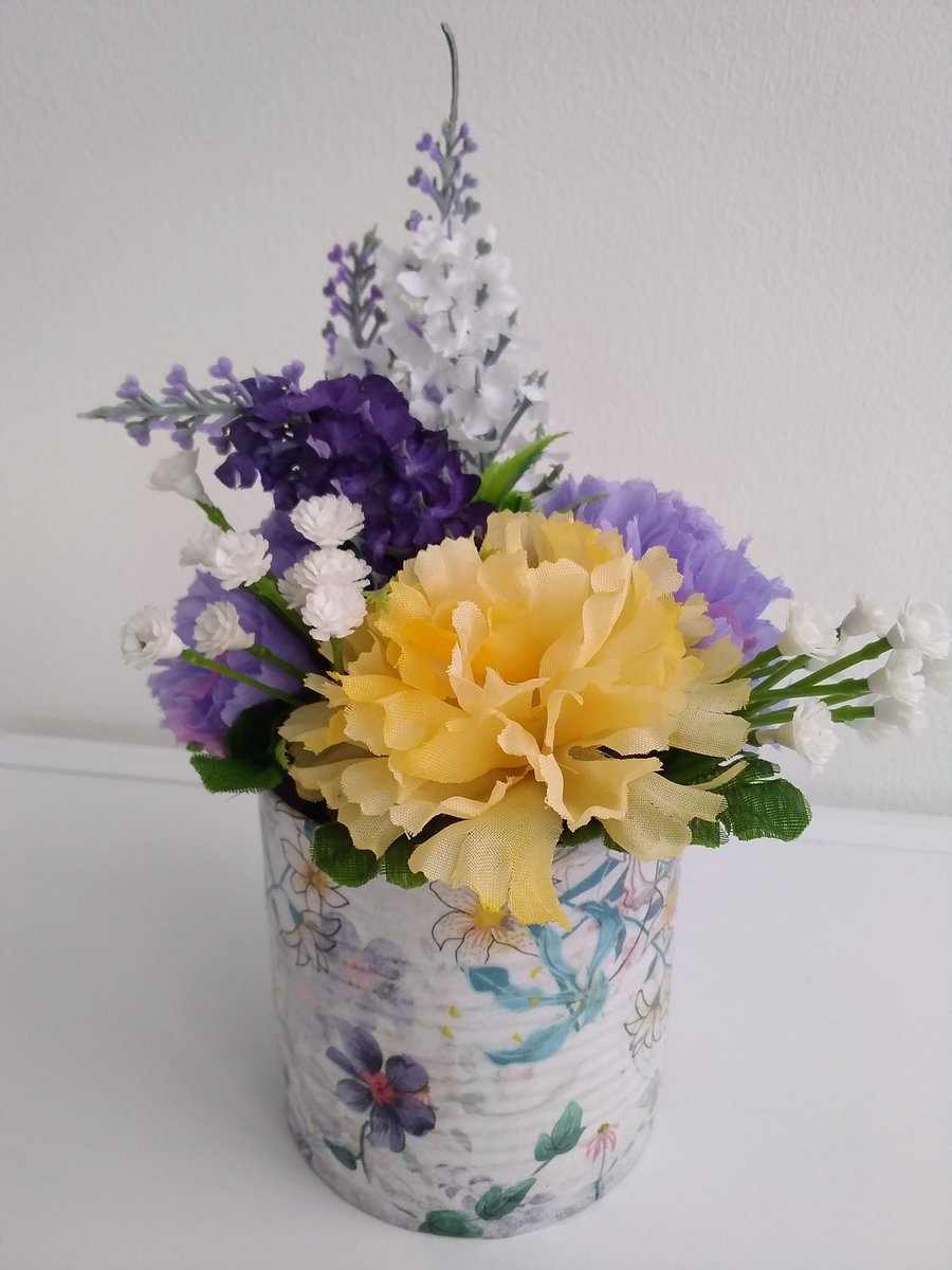 Yellow and purple tin can floral