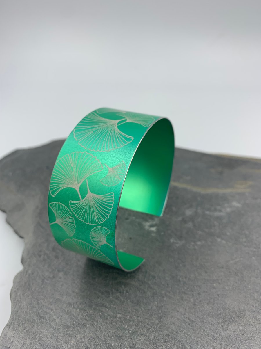 Green aluminium ginkgo cuff.