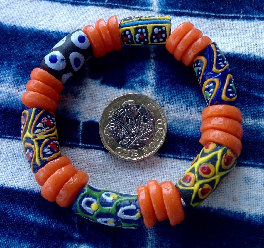 6.5" African bead bracelet with orange disks and multicolour beads