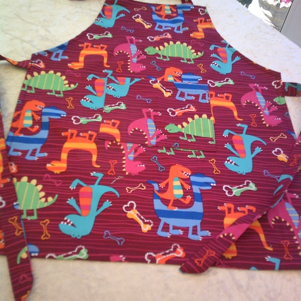 Comical Dinosaurs on Maroon Child's Apron