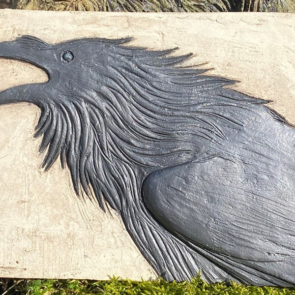 Raven cawing plaque tile in ceramic stoneware.