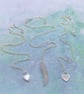 Set of 3 layered necklaces with rose quartz and mother of pearl charms - Image 1