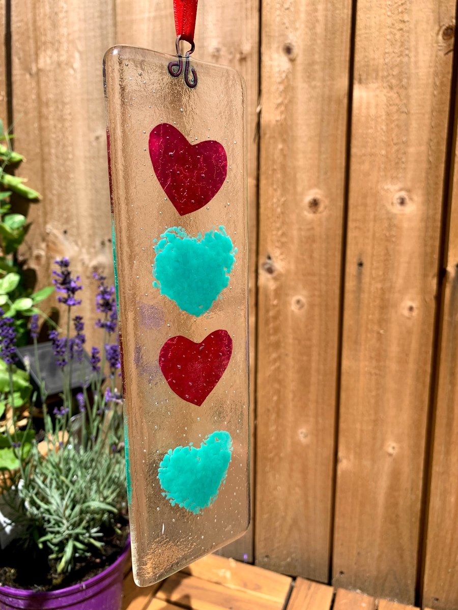 Fused glass hanging with copper foil and green hearts