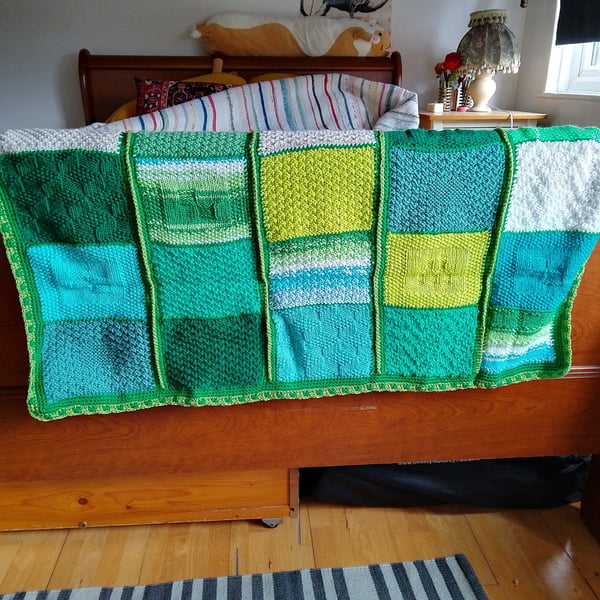 baby and toddler handmade knitted baby blanket in green colourway.