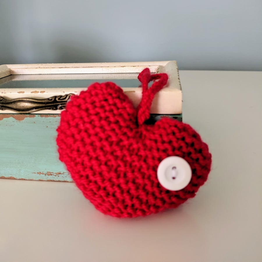 Hand-knitted red button heart