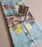Hedgehogs in primroses heart tea towel design, organic cotton, hanging loop - Image 2