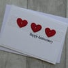 Three Red Hearts on Wicker Panel - Happy Anniversary - Anniversary Card