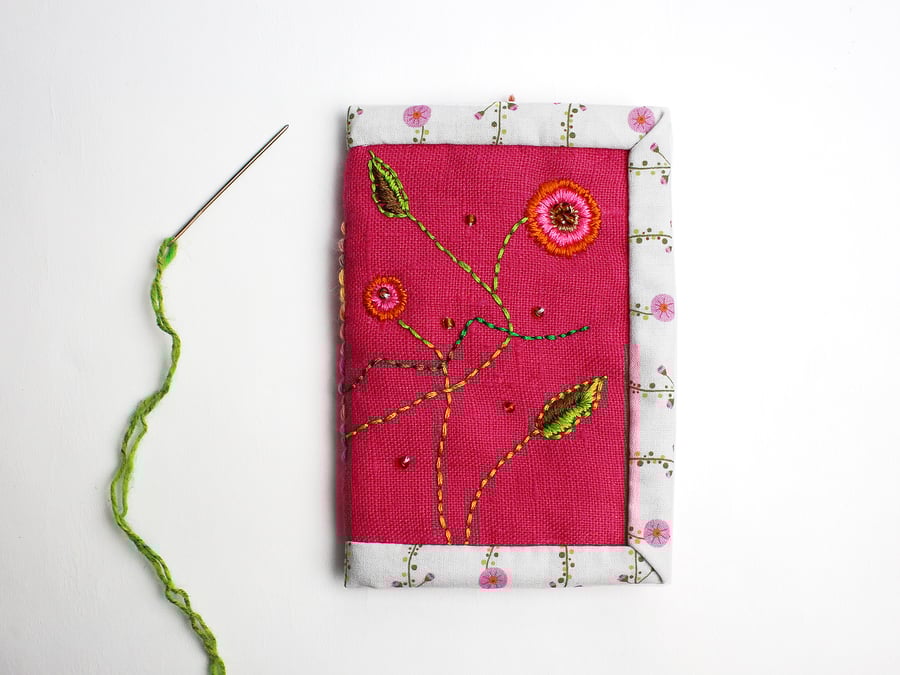 Pink linen needle case with hand embroidered Katina design