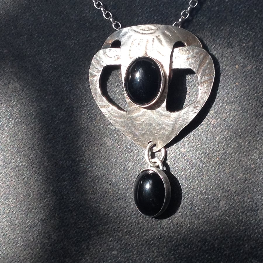 Onyx and silver shield pendant