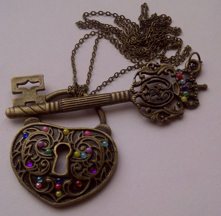 Key and Lock Pendant On A Fashionable Long Line Chain