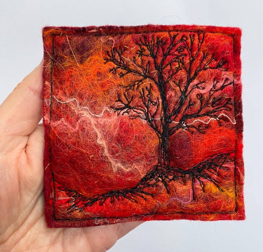 Tree silhouette with sunrise, original wet felting artwork.