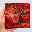 Tree silhouette with sunrise, original wet felting artwork.