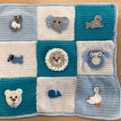 Hand Crocheted Babies blue and white blanket with appliqués 21" x 21"