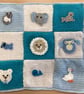Hand Crocheted Babies blue and white blanket with appliqués 21" x 21"