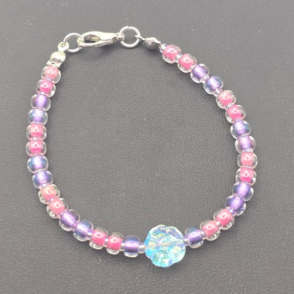 Kids pink and purple bracelet with clear crystal flower bead.