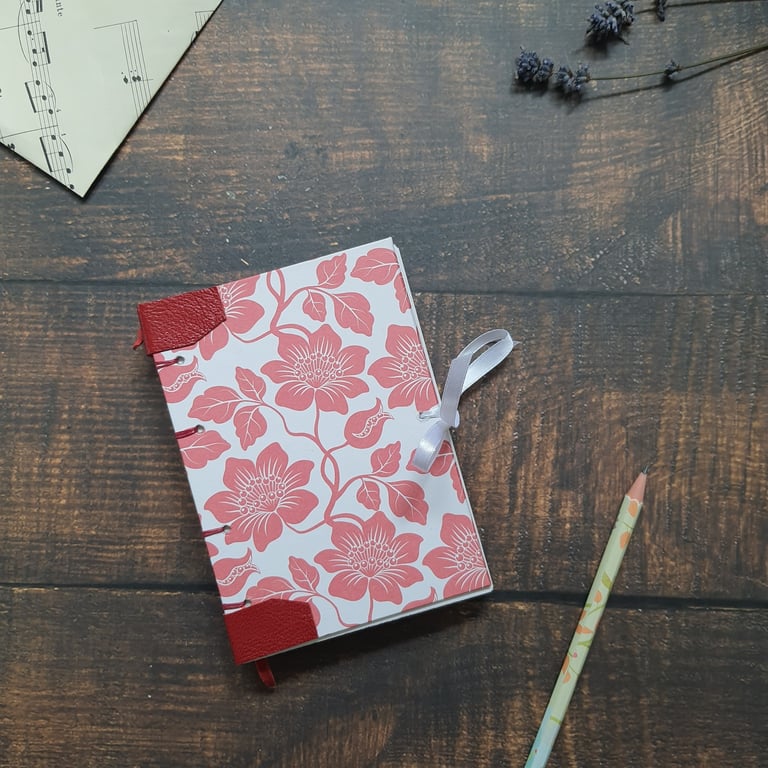 Handmade floral A6 journal, with Coptic stitching and leather detail