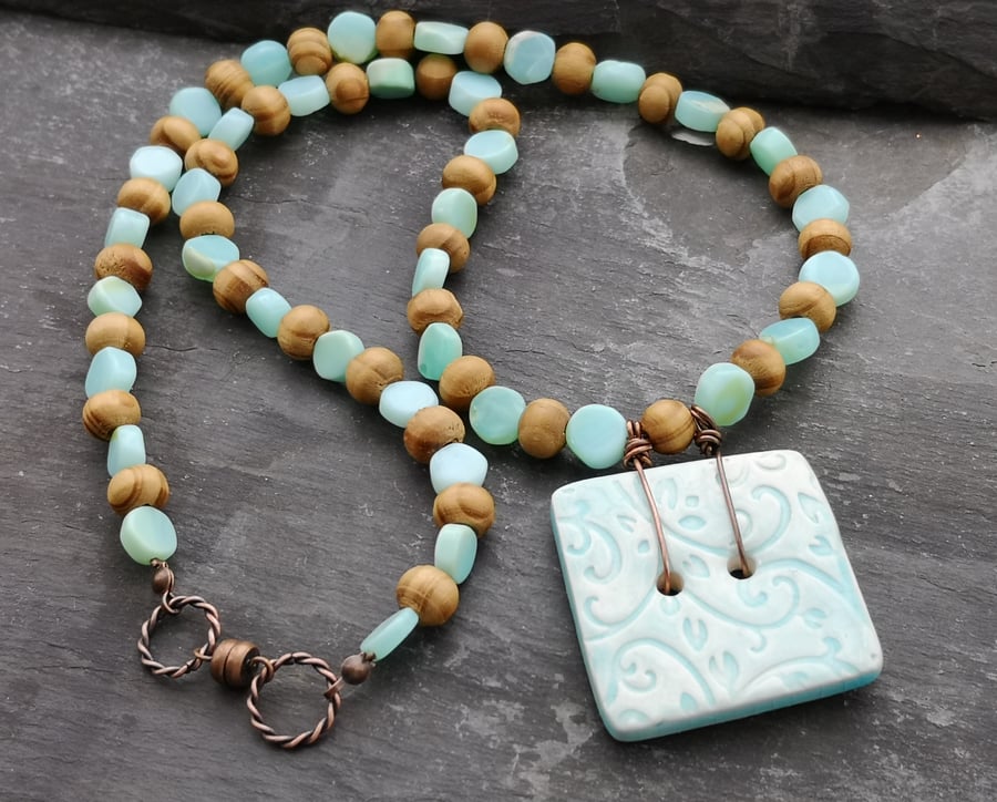 Turquoise square ceramic button with wooden and glass beads and magnetic clasp