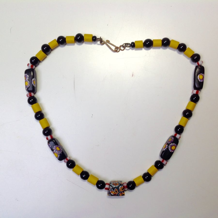 Black and yellow necklace with African trade beads