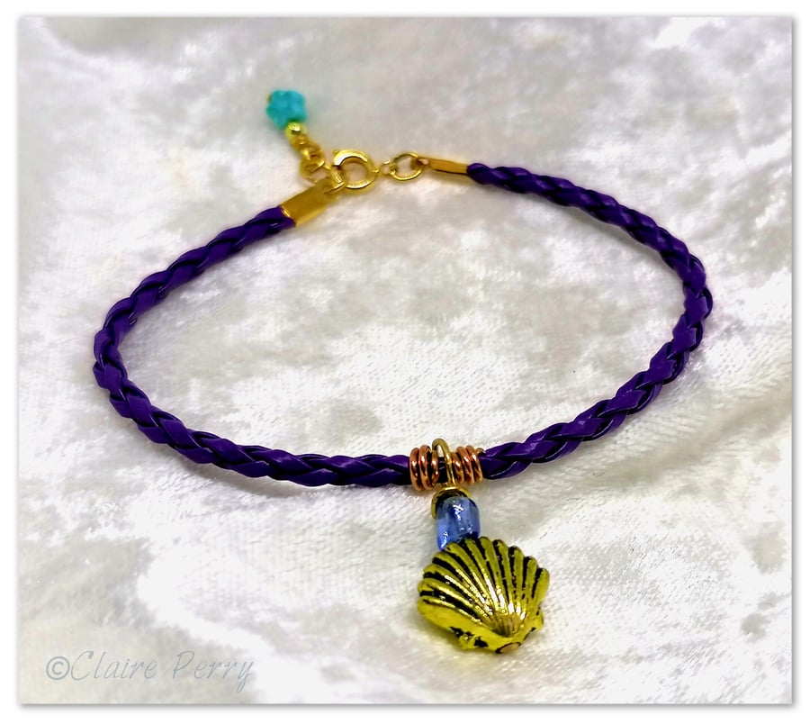 Bracelet Purple Faux Leather with gold plated Seashell charm bead.