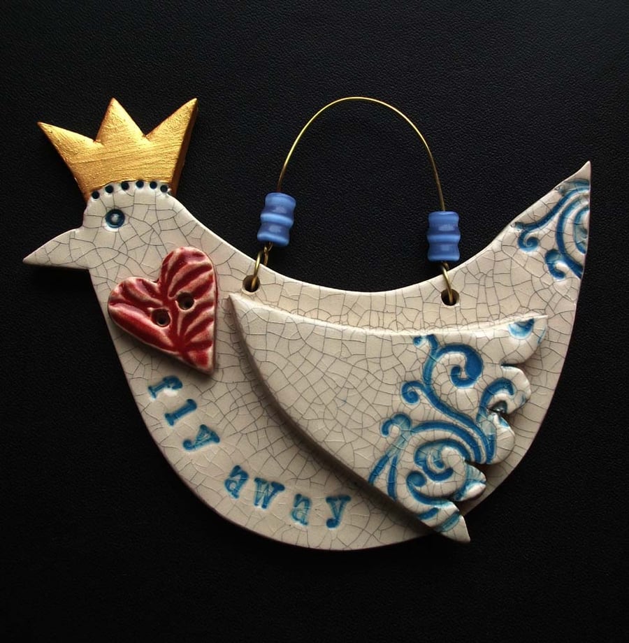 Ceramic bird decoration with crown and heart