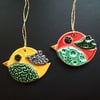 two ceramic bird decorations