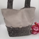 Silver and Ash grey chenille handbag with decorative buttons. 