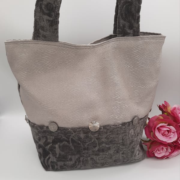 Silver and Ash grey chenille handbag with decorative buttons. 