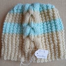 Hand-knitted baby hat. Approx 0 to 3 months.  Price includes P and P. 