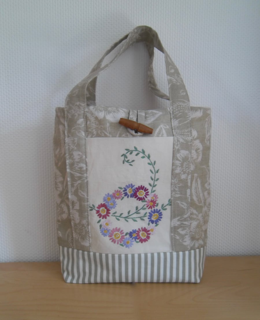 Green fabric hand bag small tote bag with vintage embroidered flowers.