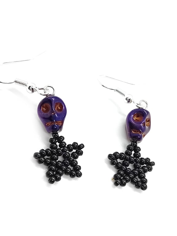 Metallic pearlescent purple skull and black star beaded earrings