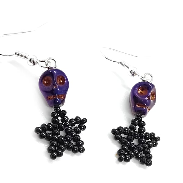 Metallic pearlescent purple skull and black star beaded earrings
