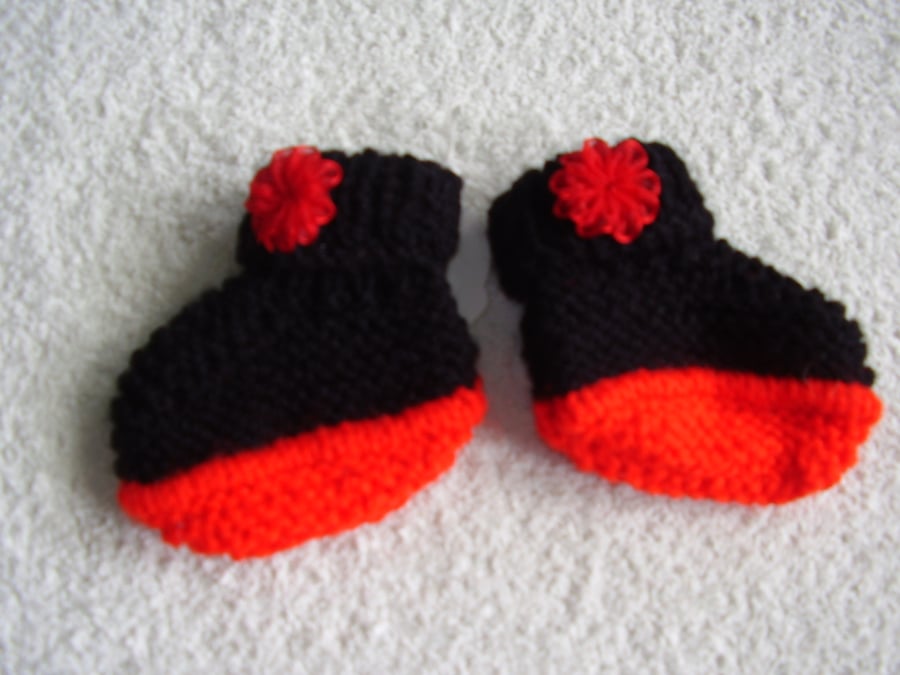 Bootees hand knitted in red and black