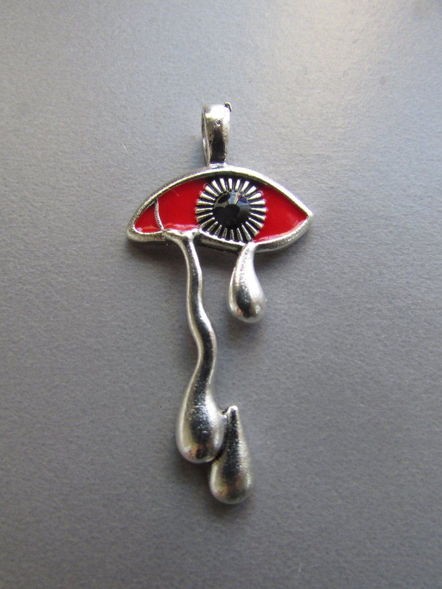 Silver and Red Bleeding Eye Tibetan Jewellery Charm