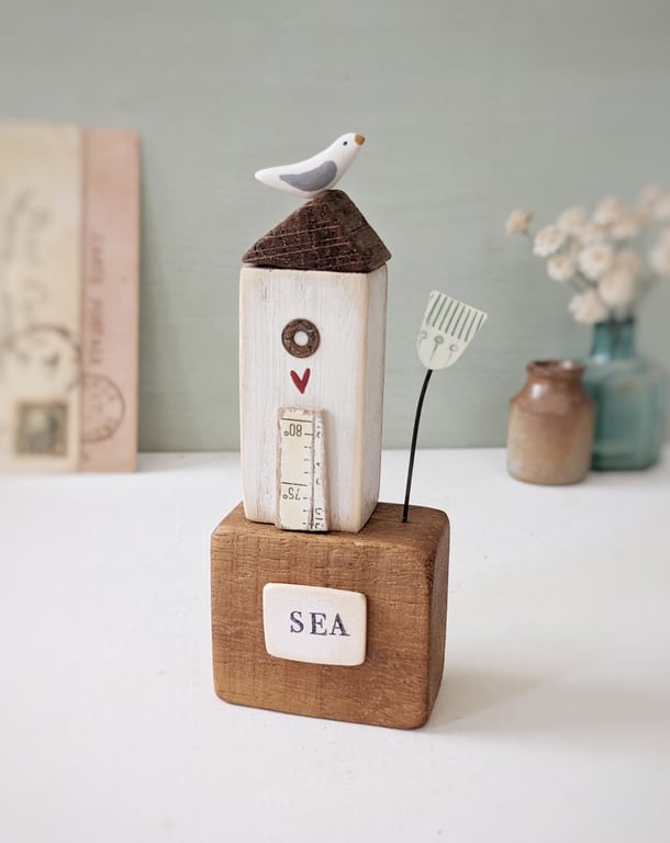Tall Wooden Sea Hut with Clay Flower and Seagull 'Sea'