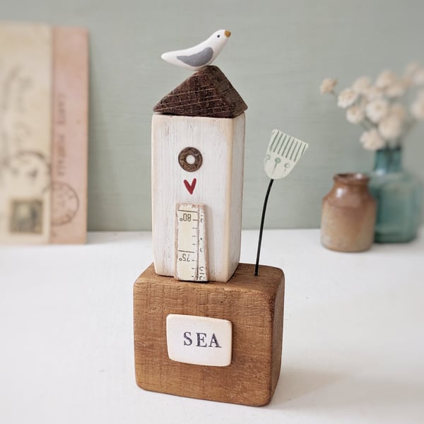 Tall Wooden Sea Hut with Clay Flower and Seagull 'Sea'