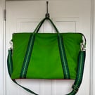 Large, zip top, soft-sided, waved canvas bag.