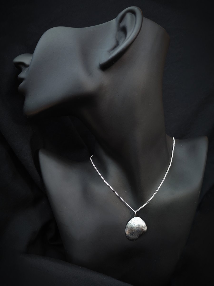 Sterling silver seashell with silver pearl