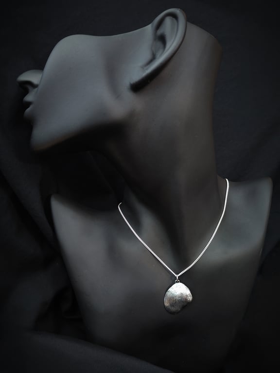 Sterling silver seashell with silver pearl