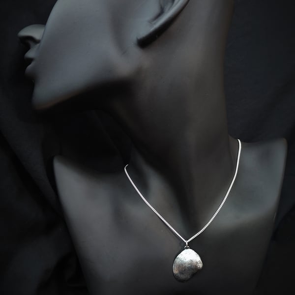Sterling silver seashell with silver pearl